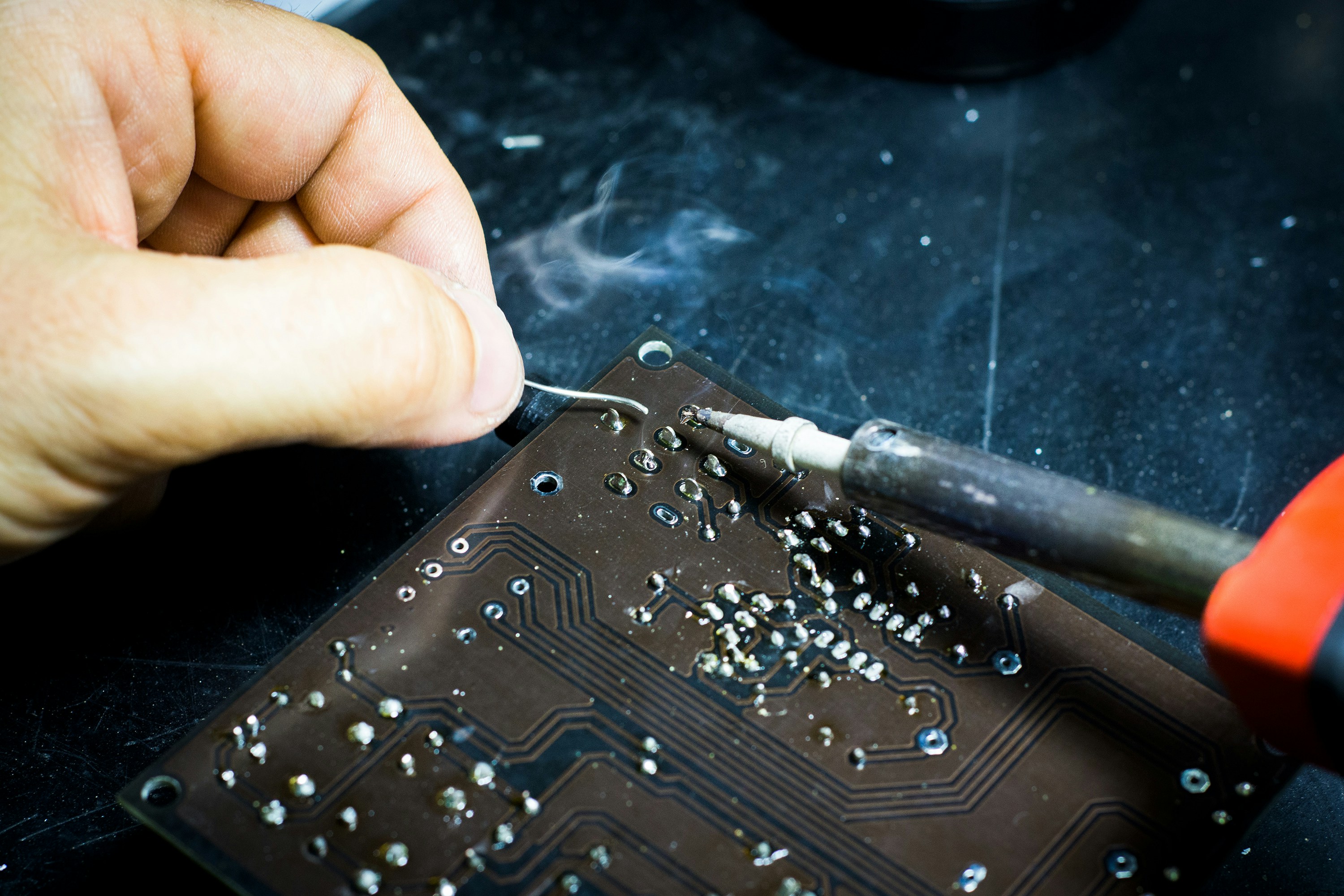 Cerberus technician repairing a small electronic device
